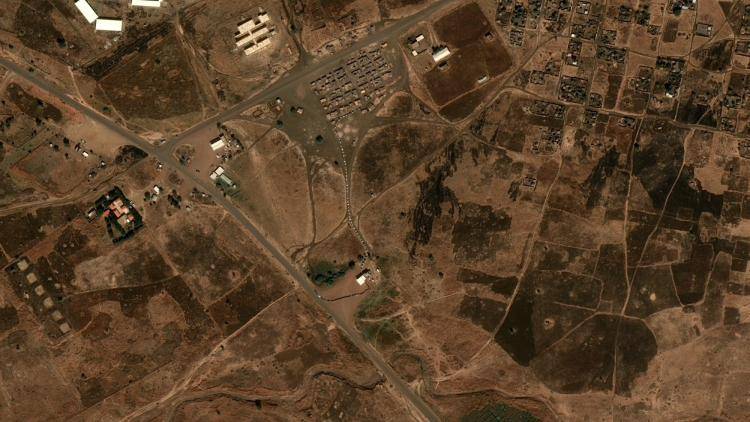 A satellite image of the Ethiopia Sudan borde, showing roads, buildings and checkpoints